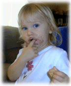 ANDREA WITH COOKIE ON MOUTH